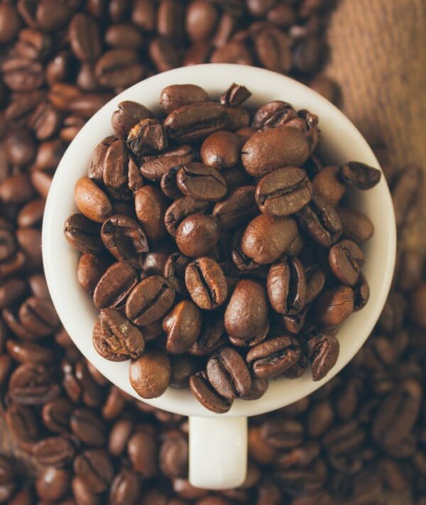 Coffee Beans in White Ceramic Mug